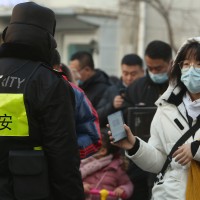 Chinese Show Security Health Status on Smarphone App in Beijing, China