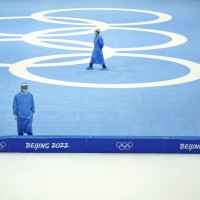 Medical personnel stand ready for activity during a scheduled speedskating practice session inside at the National Speed Skating Oval the 2022 Winter Olympics