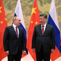 Chinese President Xi Jinping, right, and Russian President Vladimir Putin pose for a photo prior to their talks in Beijing.
