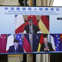 French President Emmanuel Macron, German Chancellor Olaf Scholz, below right, and Chinese President Xi Jinping, top, discussing the Ukraine crisis during a video-conference