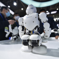 Visitors view interactive programmable robots at the China (Nanjing) International Software Products and Information Services Trade Expo 2022 in Nanjing, Jiangsu province, China, Nov 23, 2022.