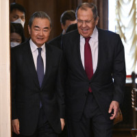 Russian Foreign Minister Sergey Lavrov, right, and the Chinese Communist Party's foreign policy chief Wang Yi enter a hall for their talks in Moscow, Russia, Wednesday, Feb. 22, 2023. 