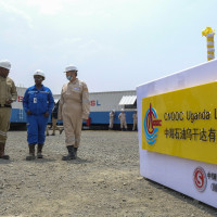 Ugandan and Chinese workers at an oil field in western Uganda