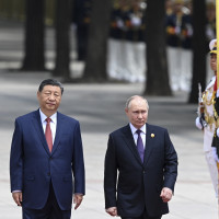 Chinese President Xi Jinping, left, and Russian President Vladimir Putin review the honor guard during an official welcome ceremony in Beijing, China, Thursday, May 16, 2024.