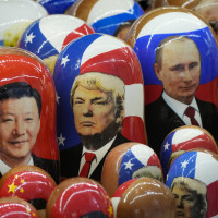 Traditional Russian wooden dolls called Matryoshka depicting China's President Xi Jinping, U.S. President-elect Donald Trump and Russian President Vladimir Putin are displayed for sale at a souvenir shop in St. Petersburg, Russia.
