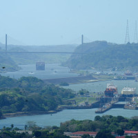 A ship sails through the Panama Canal after Hong Kong's CK Hutchison agreed to sell its interests in a key Panama Canal port operator to a BlackRock Inc-backed consortium.