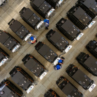 Workers debug smart mobile charging piles at Nantong Guoxuan New Energy Technology Co., LTD., located in Nantong High-tech Zone, East China's Jiangsu provincr
