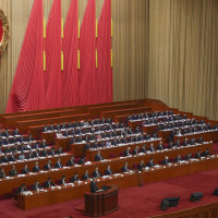 Chinese Premier Li Qiang speaks from a lectern during the opening session of the National People's Congress (NPC) at the Great Hall of the People in Beijing, China, Wednesday, March 5, 2025. 