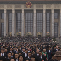 Delegates leave the Great Hall of the People after attending the closing ceremony of the National People's Congress in Beijing, Tuesday, March 11, 2025. 