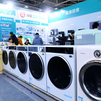 Chinese citizens look at home appliances. The Chinese government introduced trade-in programs on costlier household purchases like washing machines and fridges to lift consumption in Q2 2025.
