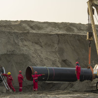 Workers labor at the construction site of the China-Russia east route natural gas pipeline in Hai'an in eastern China's Jiangsu province Saturday, March 12, 2022.