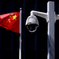 Security cameras in front of a Chinese flag