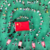 Kindergarten children pose with national flags in Lianyungang, Jiangsu province, China.