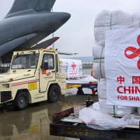 Staff members load disaster relief supplies provided by the Chinese government at Zhengzhou Xinzheng International Airport in Zhengzhou, central China's Henan Province, Sept. 27, 2025.