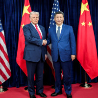 U.S. President Donald Trump, left, greets Chinese President Xi Jinping, right, before a bilateral meeting at Gimhae Air Base, October 30, 2025, in Busan, South Korea. 