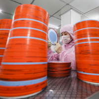 Workers stepped up the production of chips for orders at home and abroad