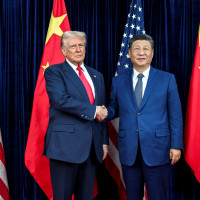 U.S. President Donald Trump, left, greets Chinese President Xi Jinping, right, before a bilateral meeting at Gimhae Air Base, October 30, 2025, in Busan, South Korea.