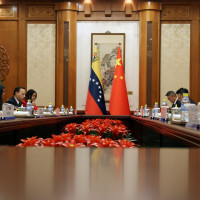Chinese Foreign Minister Wang Yi, right, and Venezuelan Foreign Minister Yvan Gil Pinto, left, attend a meeting at the Diaoyutai State Guesthouse in Beijing, Monday, May 12, 2025.