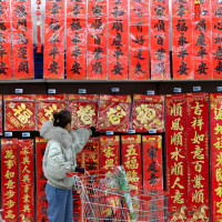 A Chinese consumer is shopping for spring couplets at a supermarket in Zaozhuang City, Shandong Province, China on January 9, 2026