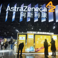 Visitors visit Astrazeneca's stand at the China International Import Expo in Shanghai