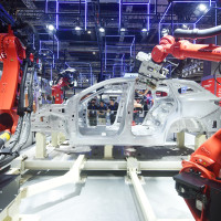 Robots make cars at the China International Industrial Expo in Shanghai