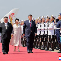 In this photo provided by the North Korean government, North Korean leader Kim Jong Un, front left, and his wife Ri Sol Ju, see off Chinese President Xi Jinping, center right, and his wife Peng Liyuan at the airport in Pyongyang, Tuesday, June 9, 2026. 