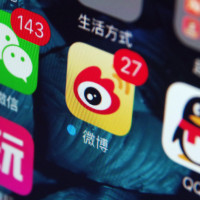 Icons of the messaging apps Weixin (WeChat), left, QQ, right, and Weibo, center