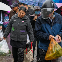 NANJING, CHINA - NOVEMBER 9, 2025 - Citizens shopping at a farmers' market in Nanjing, China's Jiangsu Province on November 9, 2025.