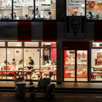 Customers dine inside a two-storey restaurant complex housing a KFC outlet on the ground floor and other restaurants on the upper floor in Beijing, China, July 12, 2026. REUTERS/Maxim Shemetov