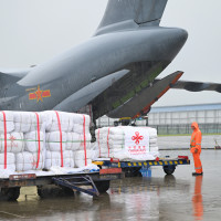 Staff members load flood relief supplies provided by the Chinese government to Pakistan at Zhengzhou Xinzheng International Airport in Zhengzhou, central China's Henan Province, Sept. 27, 2025. 