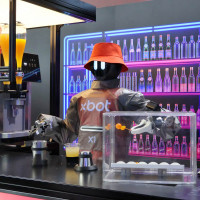 A humanoid robot showcases its cocktail making skills at the 2026 World Robot Conference in Beijing.