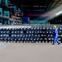 A technician inspects the quality of steel products to be delivered, Zhangjiakou City, Hebei Province, China
