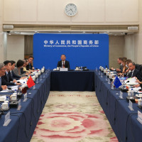 View of Wang Wentao Chinese Minister of Commerce sitting at the head of a large meeting table with Maros Sefcovic European Commissioner for Trade and Economic Security and Interinstitutional Relations on the right side during a meeting at the Ministry of Commerce in Beijing China on 8 October 2026.