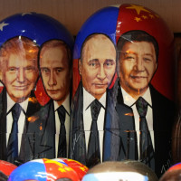 Matryoshkas, the traditional Russian wooden dolls, with images of U.S. President Donald Trump, Russian President Vladimir Putin and China's President Xi Jinping 