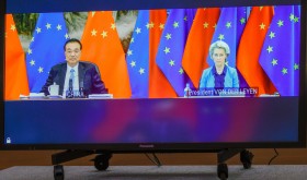 Chinese Premier Li Keqiang (L) and European Commission President Ursula von der Leyen (R) speak via video-conference with European Council President Charles Michel, and European Union foreign policy chief Josep Borrell, during an EU China summit at the European Council building in Brussels, Belgium