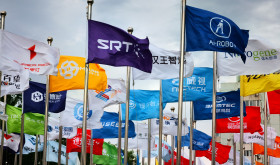 actory flags of famous Chinese enterprises flutter in the wind under the blue sky in front of the square of the permanent site of the Zhongguancun Forum in Beijing, China, May 14, 2024.
