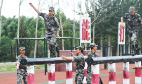Chinese soldiers take part in a training session at the Academy of Armored Forces Engineering of the Peoples Liberation Army (PLA) in Beijing, China, 22 July 2014.