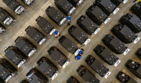 Workers debug smart mobile charging piles at Nantong Guoxuan New Energy Technology Co., LTD., located in Nantong High-tech Zone, East China's Jiangsu provincr