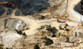 An excavator loads trucks with rare earth at a mine in Mojiang Hani Autonomous County, Simao city, southwest Chinas Yunnan province, 18 March 2008. 