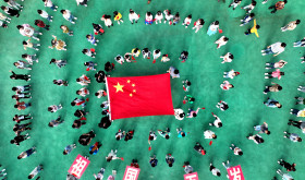 Kindergarten children pose with national flags in Lianyungang, Jiangsu province, China.