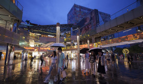 People shop at Taikoo Li Sanlitun in Beijing, China, Tuesday, July 2, 2024.