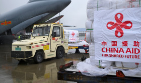 Staff members load disaster relief supplies provided by the Chinese government at Zhengzhou Xinzheng International Airport in Zhengzhou, central China's Henan Province, Sept. 27, 2025.