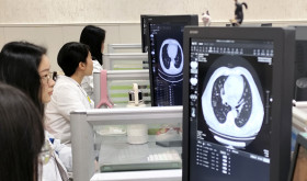 A radiologist at Shaoxing Central Hospital performs rapid and accurate diagnosis with the help of an AI image analysis system in Shaoxing, Zhejiang province, China.