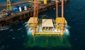 A drone photo taken on Feb. 18, 2025 shows Hainan's commercial underwater intelligent computing cluster being lowered into the sea near Lingshui Li Autonomous County in south China's Hainan Province