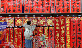 A Chinese consumer is shopping for spring couplets at a supermarket in Zaozhuang City, Shandong Province, China on January 9, 2026