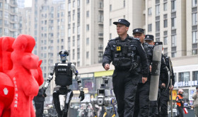 Police men and robots patrol in Hangzhou City, 13 February, 2026.