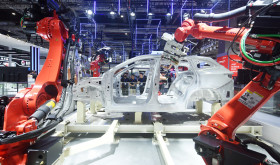Robots make cars at the China International Industrial Expo in Shanghai