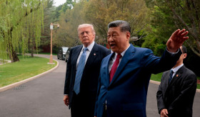 Chinese President Xi Jinping, center, gestures as he greets U.S. President Donald Trump at Zhongnanhai Garden in Beijing, Friday, May 15, 2026.