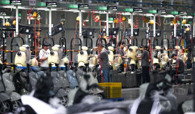 Workers assemble electric two-wheelers at AIMA Technology's production line in Tongliang District, southwest China's Chongqing, June 17, 2026.