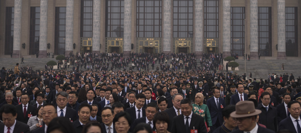 Delegates leave the Great Hall of the People after attending the closing ceremony of the National People's Congress in Beijing, Tuesday, March 11, 2025. 